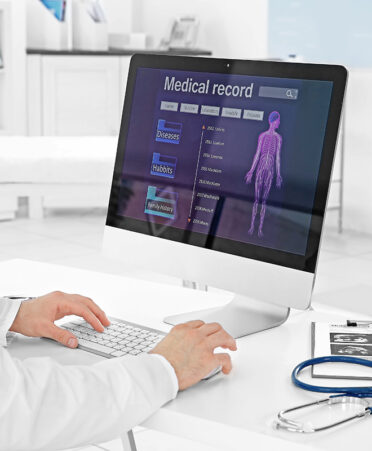 Gynecology consultation. Doctor working on computer Hendrick Health
