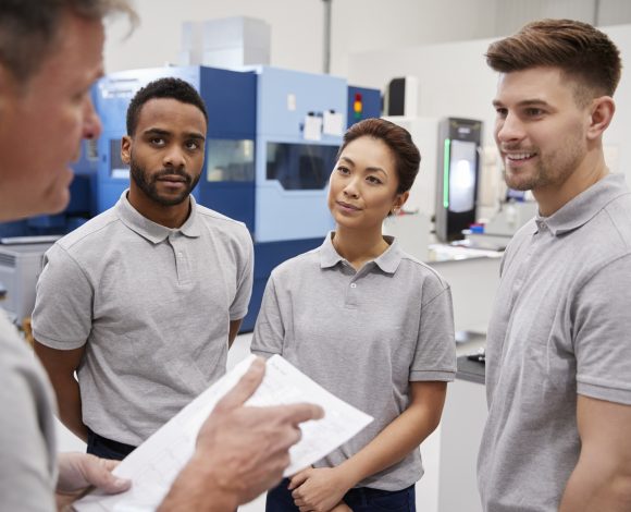 Group of employees around manager